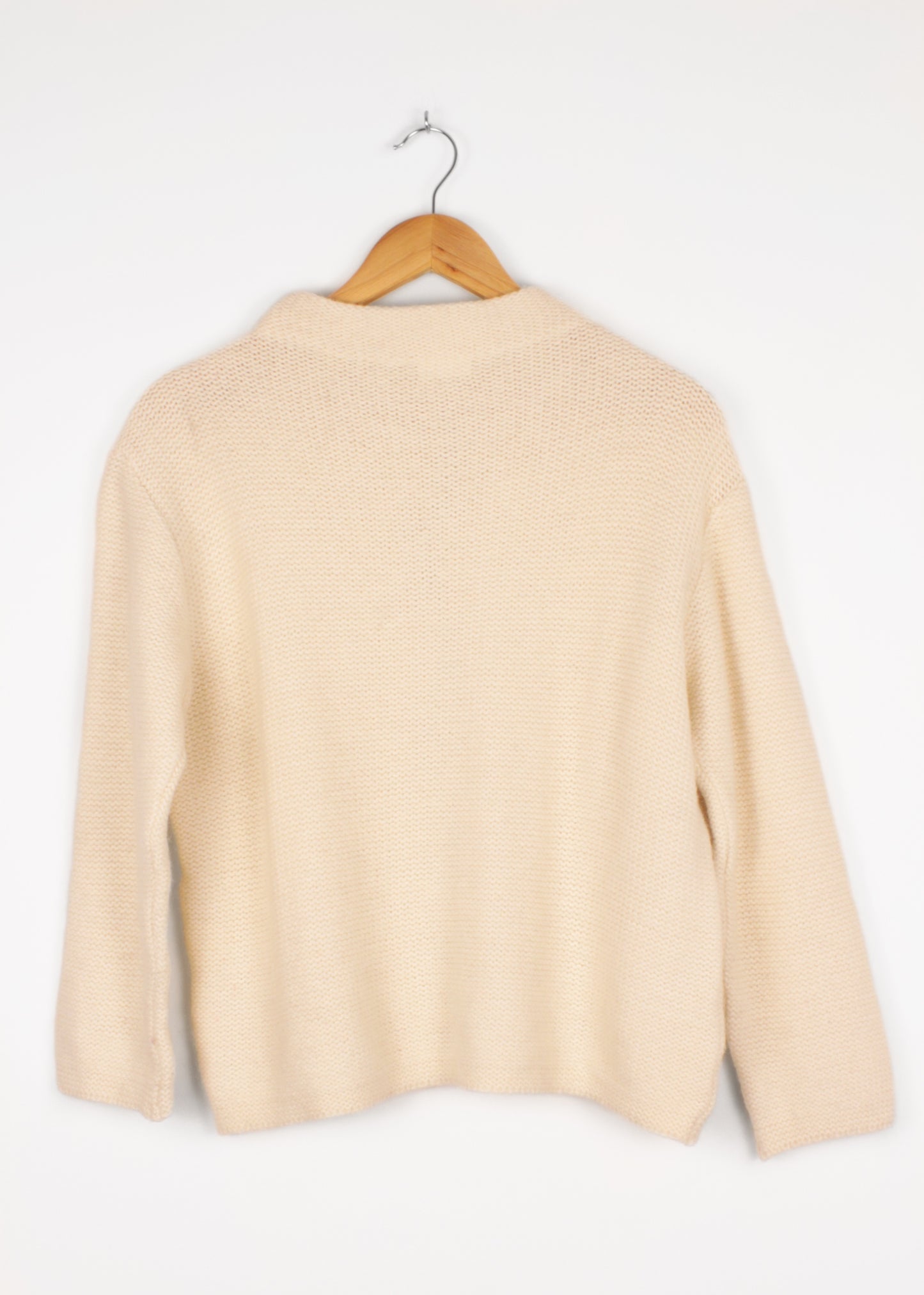 Woolen sweater in cream